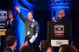 Noble participant Justin waving to the crowd at Raising the Stakes 2013